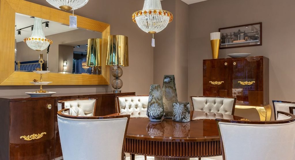 Luxury living room furniture with a beige sofa, armchairs, marble coffee table, and elegant decor in a modern sophisticated home interior.